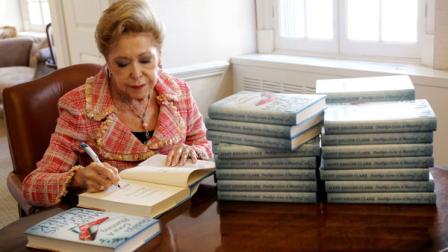 In this Wednesday, April 3 2013 photo, author Mary Higgins Clark sign copies of her latest book Daddys Gone A Hunting at the Simon and Schuster office in New York. Her current book is a vintage Clark thriller featuring women in distress, mysterious pasts and secret identities. Its about a deadly explosion that destroys a family furniture business in Long Island City. (AP Photo/Mary Altaffer)