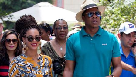 FILE - This April 4, 2013 file photo shows married musicians Beyonce, left, and rapper Jay-Z as they tour Old Havana, Cuba. Jay-Z is addressing his recent trip to Cuba in a new song. The rapper released Open Letter Thursday, April 11, after two Florida Republicans questioned if the rappers visit to Havana with wife Beyonce was officially licensed. (AP Photo/Ramon Espinosa, file)