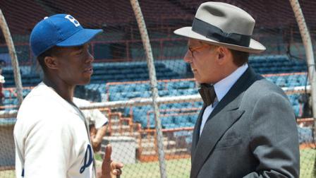 This film image released by Warner Bros. Pictures shows Chadwick Boseman as Jackie Robinson, left, and Harrison Ford as Branch Rickey in a scene from 42. (AP Photo/Warner Bros. Pictures, D. Stevens)