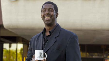 In this photo taken Wednesday, Mar. 13, 2013, former child actor Rodney Allen Rippy poses for a photo outside Compton City Hall in Compton, Calif. Rippy is running for Mayor of Compton in the upcoming April election. (AP Photo/Damian Dovarganes)