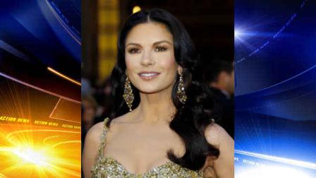 Actress Catherine Zeta-Jones arrives at the Oscars at the Dolby Theatre on Sunday Feb. 24, 2013, in Los Angeles. (Photo by Carlo Allegri/Invision/AP)