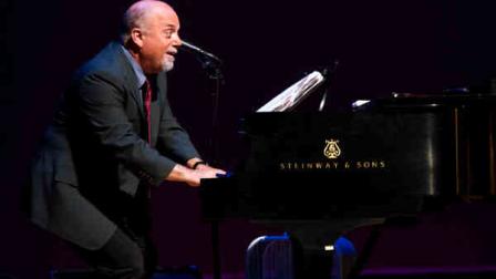 Billy Joel appears on stage at a special master class school-wide assembly event for the Frank Sinatra School of the Arts, the public high school Tony Bennett founded, on Thursday, May 30, 2013 in New York. (Photo by Charles Sykes/Invision/AP)