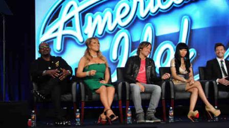 In this Jan. 8, 2013 publicity photo released by Fox, American Idol Season 11, from left, Judges Randy Jackson, Mariah Carey, Keith Urban, Nicki Minaj and Host Ryan Seacrest answer questions from television critics during the 2013 FOX Winter TCA at the Langham Hotel, in Pasadena, Calif. (AP Photo/FOX, Frank Micelotta)