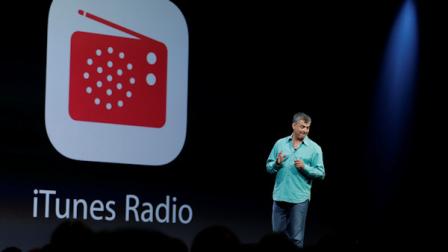 Eddy Cue the Apple senior vice president of Internet Software and Services introduces the new iTunes Radio during the keynote address of the Apple Worldwide Developers Conference Monday, June 10, 2013 in San Francisco. (AP Photo/Eric Risberg)