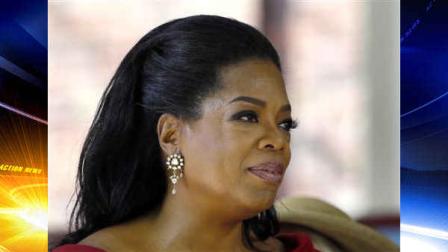 FILE - In this May 30, 2013 file photo Oprah Winfrey reacts after delivering the commencement address at Harvard University in Cambridge, Mass. Winfrey is giving $12 million to a museum being built on the National Mall that will document African-American life. The National Museum of African American History and Culture said the museums 350-seat theater will be named after Winfrey. When its finished in 2015, the museum will house artifacts including Harriet Tubmans shawl, Emmett Tills casket and a Jim Crow-era segregated railroad car.(AP Photo/Elise Amendola, File)