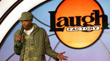 Comedian Dave Chappelle on stage at the Laugh Factory in New York City for pre-opening night, Saturday, April 3, 2004. (AP Photo/Stuart Ramson)