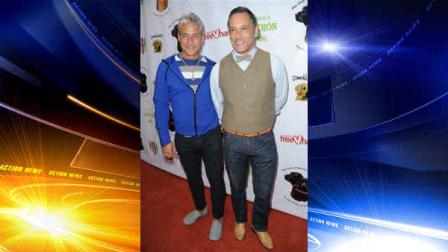 Greg Louganis, left, and John Chaillot arrive at the Saving Tails event honoring songwriter Diane Warren at a private residence on Saturday, April 13, 2013 in Los Angeles. (Photo by Richard Shotwell/Invision/AP)