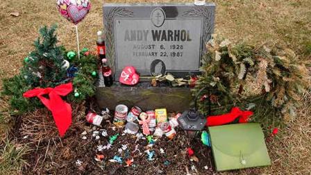 The head stone of Andy Warhol is surrounded by mementos in St. John The Baptist Byzantine Cemetery in Bethel Park, Pa., Tuesday, Feb. 21, 2012. Feb. 22, 2012 marks the 25th anniversary of the pop artists death due to complications of Gall Bladder surgery at the age of 58. (AP Photo/Gene J. Puskar)