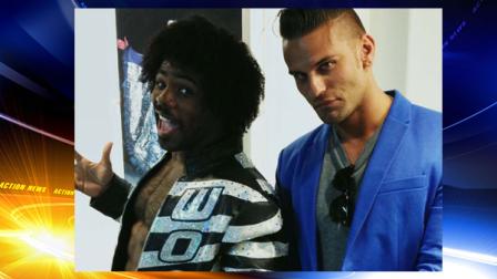 In this July 31, 2013 photo, wrestlers Xavier Woods, left, and Corey Graves pose inside the new World Wrestling Entertainment Performance Center in Orlando, Fla. The $2.5 million, 26,000-square foot facility opened in July, replacing a smaller, antiquated facility in Tampa, Fla. The facility is both a graduate school and a training and rehabilitation center. (AP Photo/Kyle Hightower)