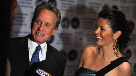 Actor Michael Douglas and Catherine Zeta Jones arrive at the United Nations Association Global Leadership Awards Gala at The Waldorf Astoria in New York on Wednesday, Oct. 1, 2008. (AP Photo/Peter Kramer)