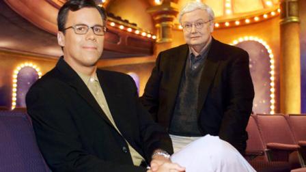 FILE - Chicago Sun-Times columnist Richard Roeper, left, sits with Sun-Times film critic Roger Ebert on the set of the newly named Ebert and Roeper and The Movies Wednesday, July 12, 2000, in Chicago. (AP Photo/Fred Jewell)