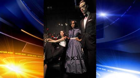 This Oct. 2, 2013 photo released by ABC shows actress Kerry Washington posing next to a mannequin in a tuxedo, part of an installation honoring the TV series Scandal, at Saks 5th Avenue in New York. The season premiere airs Thursday, Oct. 3 at 10 p.m. EST on ABC. (AP Photo/ABC, Lou Rocco)