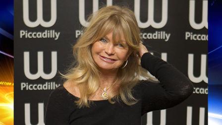 U.S actress Goldie Hawn arrives to sign copies of her new book, 10 Mindful Minutes, in collaboration with acclaimed British poet Wendy Holden, at a book store in Piccadilly, London, Wednesday, Mar. 7, 2012. (AP Photo/Joel Ryan)