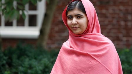 Malala Yousafzai listens as Harvard President Drew Gilpin Faust, not pictured, introduces her to reporters at Harvard University Friday, Sept. 27, 2013, on the schools campus in Cambridge, Mass. The Pakistani teenager, an advocate for education for girls, survived a Taliban assassination attempt last year on her way home from school. (AP Photo/Jessica Rinaldi)