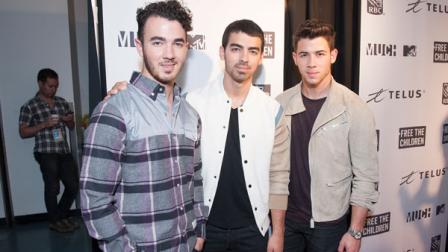 Kevin Jonas, Joe Jonas, and Nick Jonas are seen at We Day at the Air Canada Centre on Friday, Sept. 20, 2013, in Toronto, Canada. (Photo by Arthur Mola/Invision/AP)
