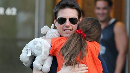 This Tuesday July 17, 2012 photo shows actor Tom Cruise and daughter Suri Cruise leaving Chelsea Piers in New York. Cruise wrote in a sworn declaration filed Tuesday Nov. 5, 2013, in a defamation lawsuit against Bauer Publishing Co. that he maintains a close relationship with his daughter Suri despite the claims by two Bauer tabloids in 2012 that he had abandoned her. (AP Photo/ Donald Traill)