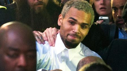 FILE - In this Monday, Oct. 28, 2013 file photo, singer Chris Brown, center, departs the H. Carl Moultriel courthouse after he was released from jail following his arrest for allegedly punching another man, in Washington. A representative for the R&B star announced Tuesday, Oct. 29, 2013 that Brown has decided to go to rehab to gain focus and insight into his past and recent behavior, enabling him to continue the pursuit of his life and his career from a healthier vantage point. (AP Photo/Cliff Owen, File)