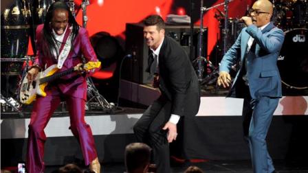 From left, Verdine White of Earth, Wind and Fire, Robin Thicke and T.I. perform onstage at the Nominations Concert for the 56th Annual Grammy Awards, on Friday, December 6, 2013 at Nokia Theatre L.A. Live in Los Angeles, Calif. (Photo by Frank Micelotta/Invision/AP)