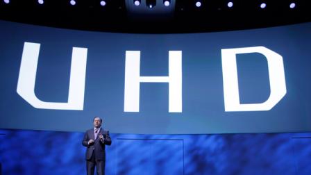 Samsung Electronics America Executive Vice President Joe Stinziano introduces a 105-inch ultra high definition curved television during a news conference at the International Consumer Electronics Show, Monday, Jan. 6, 2014, in Las Vegas. (AP Photo/Isaac Brekken)