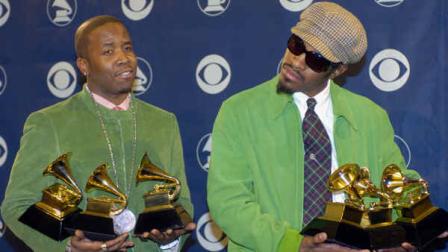 OutKast members Big Boi, left, and Andre 3000 pose with the three awards they won at the 46th Annual Grammy Awards, Sunday, Feb. 8, 2004, in Los Angeles. (AP Photo/Reed Saxon)