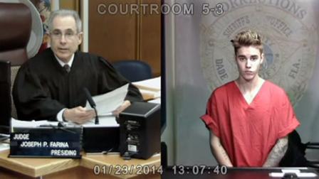 Justin Bieber appears in court via video feed, Thursday, Jan. 23, 2014, in Miami. Bieber was released from jail Thursday following his arrest on charges of driving under the influence, driving with an expired license and resisting arrest. Police say they stopped the 19-year-old pop star while he was drag-racing down a Miami Beach street before dawn. (AP Photo/The Miami Herald, Walter Michot, Pool)