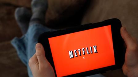 In this Friday, Jan. 17, 2014 photo, a person displays Netflix on a tablet in North Andover, Mass. (AP Photo/Elise Amendola)