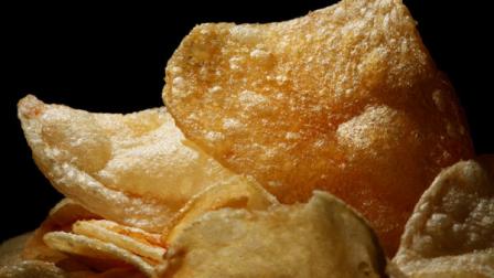 Potato chips are displayed on Wednesday, June 22, 2011, in Philadelphia. The potato chip is the biggest demon behind that pound-a-year weight creep that plagues many of us, a major diet study found. Bigger than soda, candy and ice cream. (AP Photo/Matt Rourke)