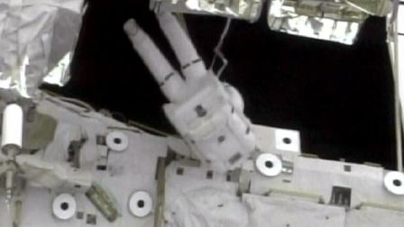 Space shuttle Atlantis Mission Specialist Randy Bresnik works during the the second spacewalk
