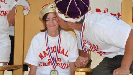 Girls marbles winner 13-year-old Penelope Bauer gets a kiss from boys marbles winner 14-year-old Corey Gollsby in Wildwood on June 24, 2010.