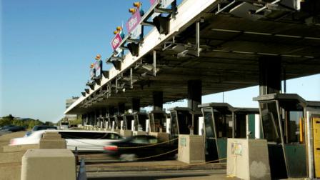 Cars drive through the toll booths on the New Jersey Turnpike in Woodbridge, N.J., Friday, Oct. 10, 2008.