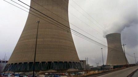 FILE - This Dec. 11, 2000, file photo, shows the cooling tower for the No. 2 reactor, left, lies dormant as steam still pours out of the other at the Beaver Valley Power Station in Shippingport, Pa. Long before the nuclear emergency in Japan, U.S. regulators knew that a power failure lasting for days at an American nuclear plant, whatever the cause, could lead to a radioactive leak. Risk analyses conducted by the plants in 1991-94 and published by the Nuclear Regulatory Commission in 2003 show that the chances of such an event striking a U.S. power plant are remote, even at the plant where the risk is the highest, the Beaver Valley Power Station in Pennsylvania. (AP Photo/Keith Srakocic, File)