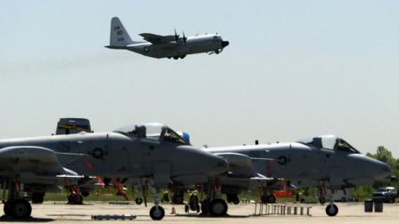 A-10s from the 111th Fighter Wing are seen in the foreground as a U.S. Navy C-130 takes off from N.A.S. J.R.B. Willow Grove, in this May 13, 2005 file photo, in Willow Grove, Pa.