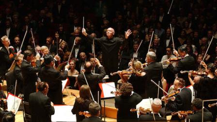 Christoph Eschenbach, new music director for the Philadelphia Orchestra , opens the orchestras 104th season with The Star Spangled Banner, Wednesday, Sept. 17, 2003, at Verizon Hall at the Kimmel Center in Philadelphia. (AP Photo/Jessica Griffin)