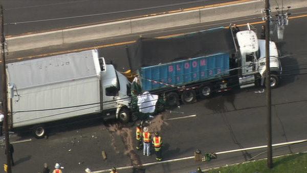 Car crushed between trucks in Camden County