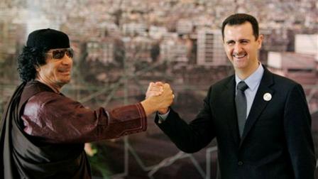 File-- In this March 2008 file photo, Libyan leader Moammar Gadhafi , left, gestures with Syrian President Bashar Assad, right, during the opening session of the Arab Summit in Damascus, Syria. When Bashar Assad inherited power in Syria in 2000, he was seen by many as a youthful new president in a region of aging dictators, a fresh face who could transform his fathers stagnant dictatorship into a modern state. Now this once-popular image of Assad, as a reformer constrained by members of his late fathers old guard, has vanished in the aftermath of one of the bloodiest government backlashes of the Arab Spring.