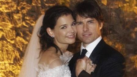 ** FILE ** In this photo released by Rogers and Cowan, actor Tom Cruise and actress Katie Holmes pose in their wedding attire on Saturday, Nov. 18, 2006, at the 15th-century Odescalchi Castle overlooking Lake Bracciano outside of Rome.