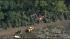 Crews search for a worker who was swept into a...