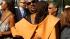 Singer Stevie Wonder embraces Susan Taylor,...