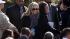 Singer Sheryl Crow, center, takes her seat...
