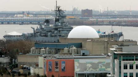 The Susquehanna Bank headquarters, Adventure Aquarium, Susquehanna Bank Centers ampitheater dome and the USS New Jersey Battleship Museum can be seen along the Delaware River Tuesday, Feb. 10, 2009, in Camden, N.J. The majestic Ben Franklin Bridge slices Camdens waterfront into two worlds. On the south side of the bridge, theres the aquarium, the battleship and Campbells Field, the minor-league baseball stadium, where families go for a good time; on the north side, chain link fences topped by razor wire surround a cluster of grimly functional buildings, Riverfront State Prison, where convicts go to serve time.