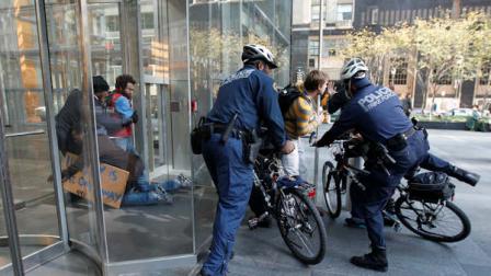 Protesters who were amongst those who marched from the Occupy Philly encampment at City Hall, try to enter the Comcast Center, Wednesday, Nov. 2, 2011, in Philadelphia. Protesters who were sitting peacefully inside the lobby of the headquarters of Comcast and refused to leave were arrested. (AP Photo/Matt Rourke)