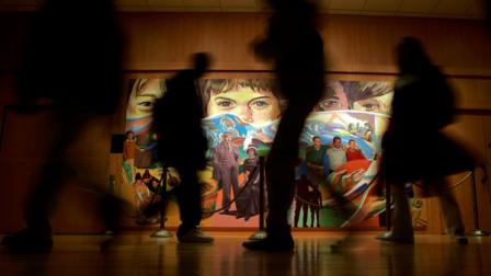 Students walk past The Apotheosis of Youth, a mural by Eliseo Art Silva at the Milton Hershey School in Hershey, Pa., Tuesday, Feb. 13, 2007. The Milton Hershey School plans to enroll 500 new students next fall. (AP Photo/Carolyn Kaster)