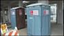 Porta-Potties outside the Marquis Apartments