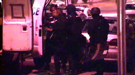 Police say a woman stabbed a man, then barricaded herself inside her West Philadelphia home for more than an hour.
