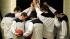Members of the Penn State basketball team pause...