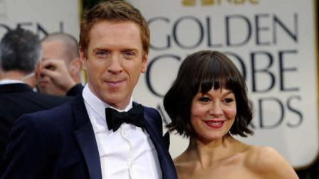 Damian Lewis and his wife, Helen McCrory, arrive at the 69th Annual Golden Globe Awards Sunday, Jan. 15, 2012, in Los Angeles. (AP Photo/Chris Pizzello)