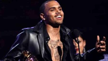 Chris Brown accepts the award for best R&B album for F.A.M.E. during the 54th annual Grammy Awards on Sunday, Feb. 12, 2012 in Los Angeles. (AP Photo/Matt Sayles)