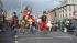 Street performers leap in midair as they make...