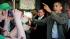 President Barack Obama greets patrons outside...