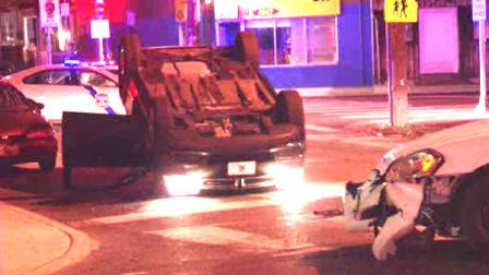 A PT Cruiser flipped over, after colliding with a Philadelphia Police patrol car.
